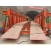 Wheeled hydraulic inverting bridge formwork